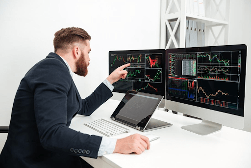 Trader reviewing forex market charts.